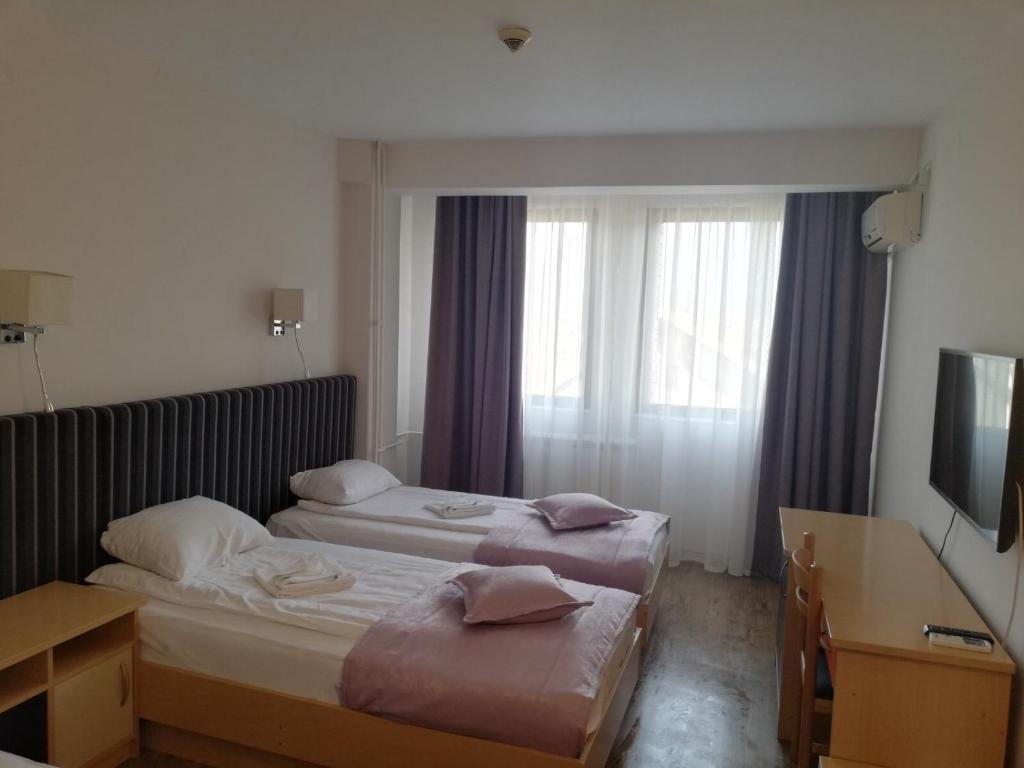 Postel nebo postele na pokoji v ubytování Zepter Hotel Drina Bajina Basta, member of Zepter Hotels