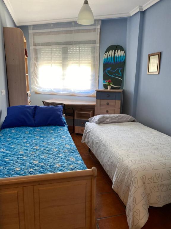 Postel nebo postele na pokoji v ubytování APARTAMENTO PUERTO FOZ