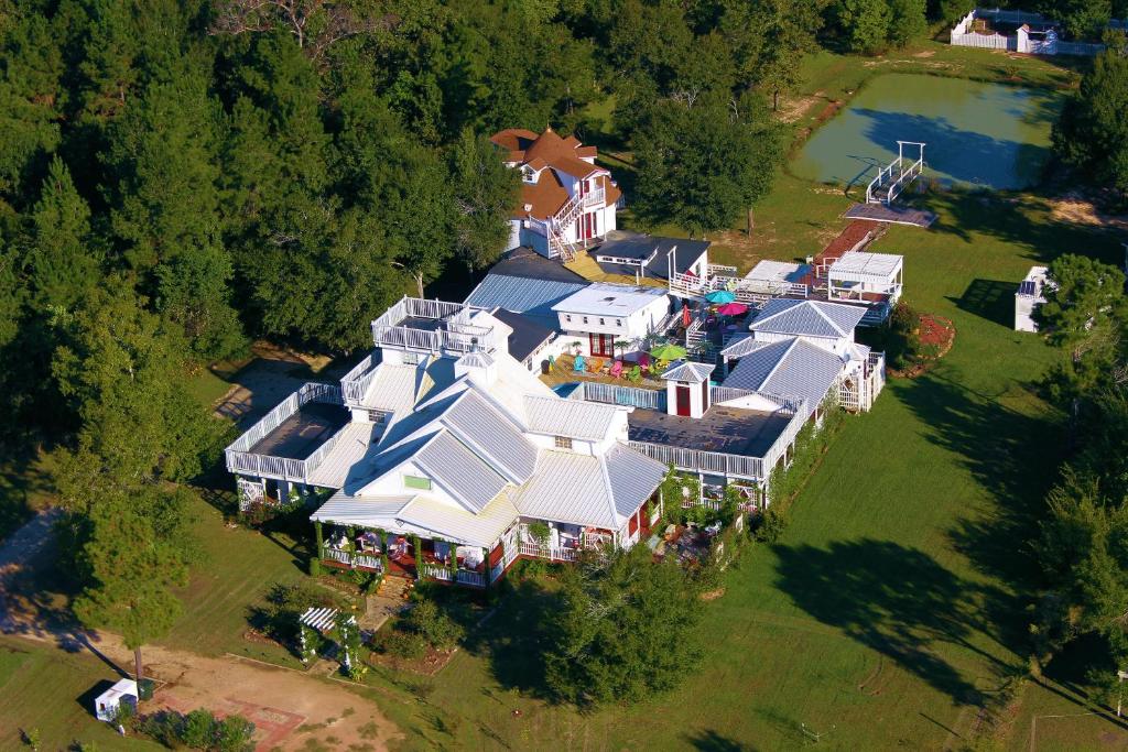 an aerial view of a large house with a yard at Book Nook Inn in Lumberton