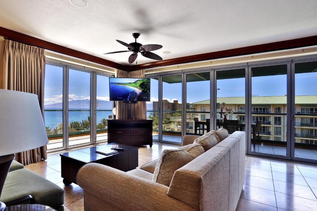 a living room with a couch and a ceiling fan at Honua Kai - Hokulani 709 - Best Ocean Views! 2b/2.5b in Kaanapali