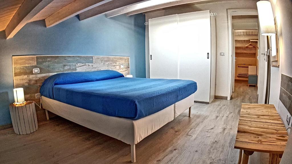Postel nebo postele na pokoji v ubytování Asinaro Residence - Fronte Mare