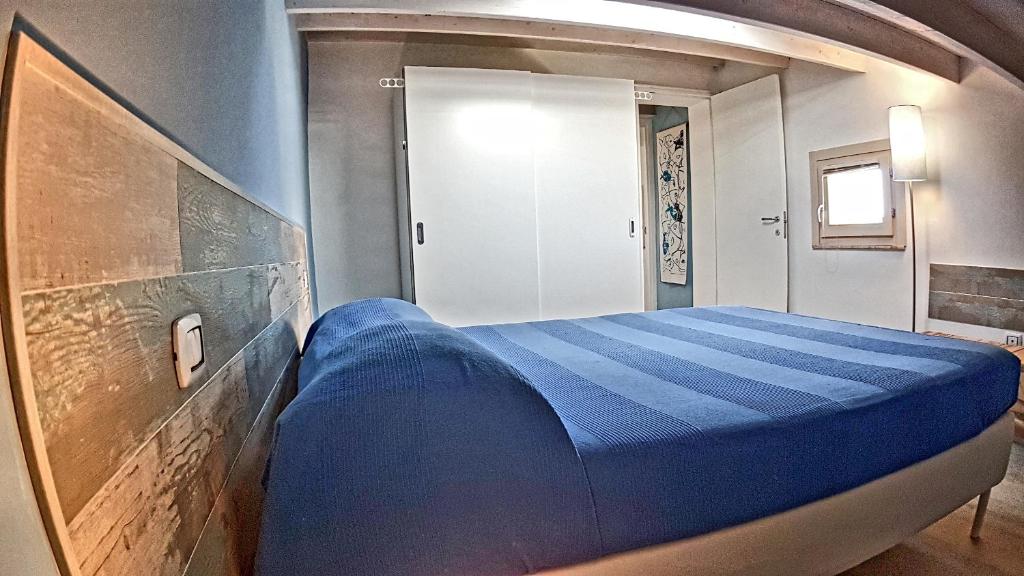 Postel nebo postele na pokoji v ubytování Asinaro Residence - Fronte Mare