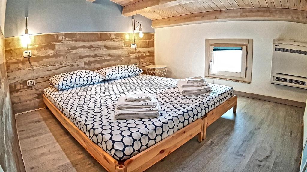 Postel nebo postele na pokoji v ubytování Asinaro Residence - Fronte Mare