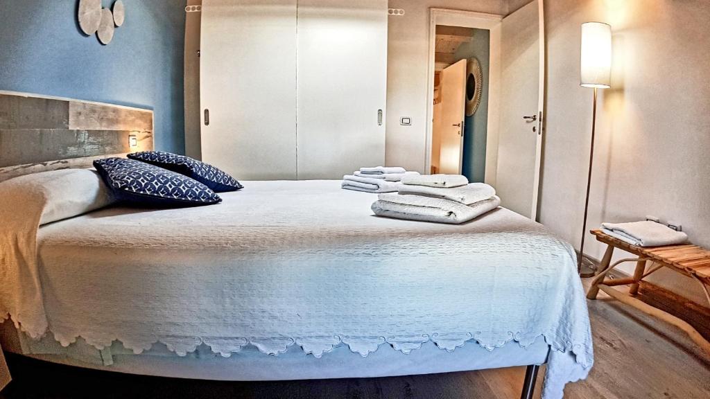 Postel nebo postele na pokoji v ubytování Asinaro Residence - Fronte Mare