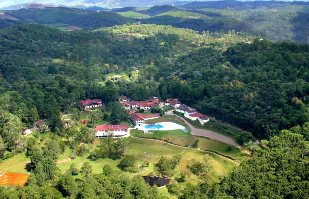 an aerial view of a house in the middle of a forest at Hotel Cabeça de Boi in Monte Verde