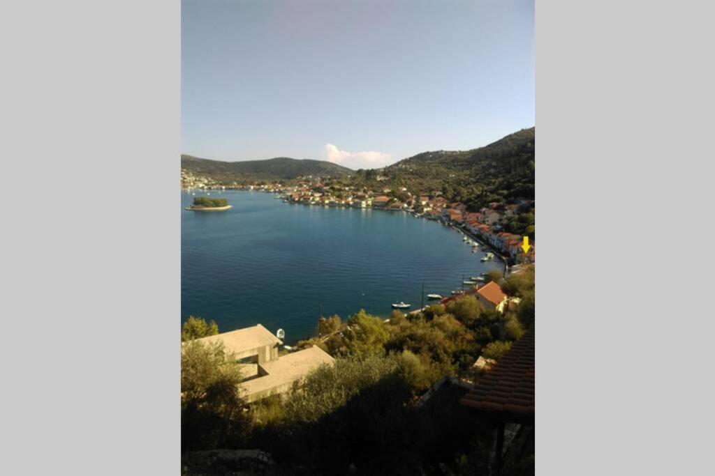 a view of a river with boats in the water at ORION (ΩΡΙΩΝ) in Vathi