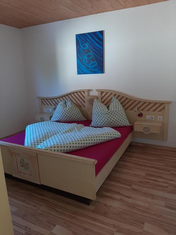a bedroom with a large bed in a room at Haus Santorum in Sankt Michael im Lungau