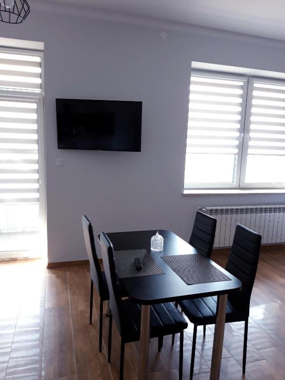 Telewizja i/lub zestaw kina domowego w obiekcie Apartamenty Polna
