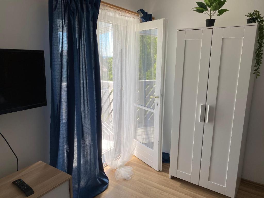 TV a/nebo společenská místnost v ubytování Babérsom apartman