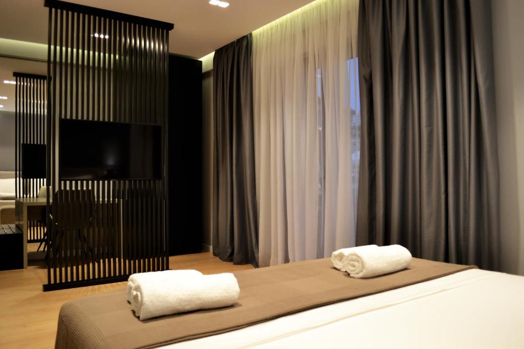 Postel nebo postele na pokoji v ubytování ArtNest Luxury Hotel & Suites
