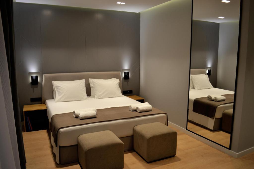 Postel nebo postele na pokoji v ubytování ArtNest Luxury Hotel & Suites