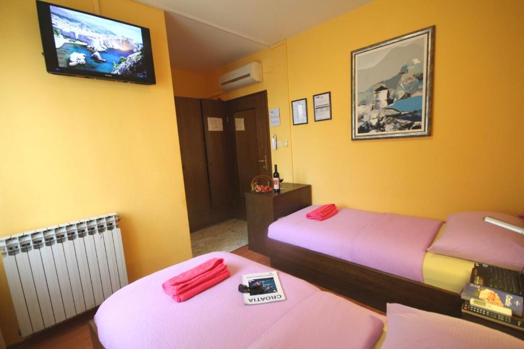 Posteľ alebo postele v izbe v ubytovaní Guest House Vila Micika Dubrovnik