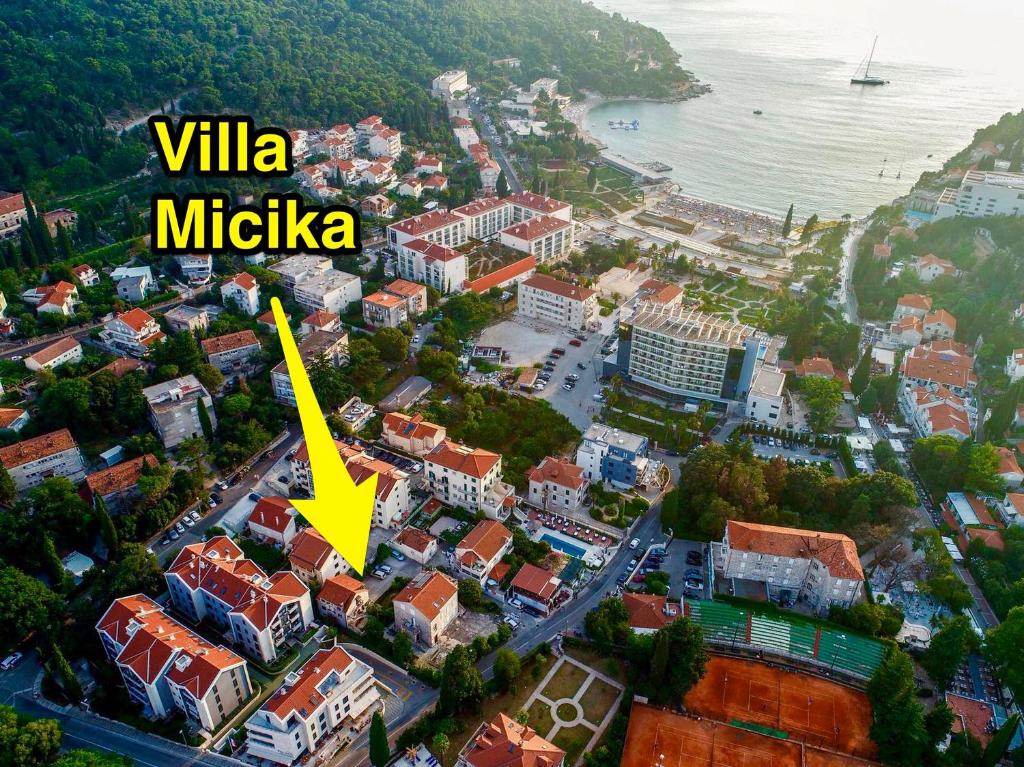 an aerial view of a city with a yellow arrow at Guest House Vila Micika Dubrovnik in Dubrovnik
