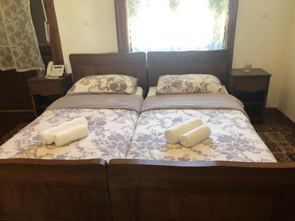 Postel nebo postele na pokoji v ubytování Hotel Lug