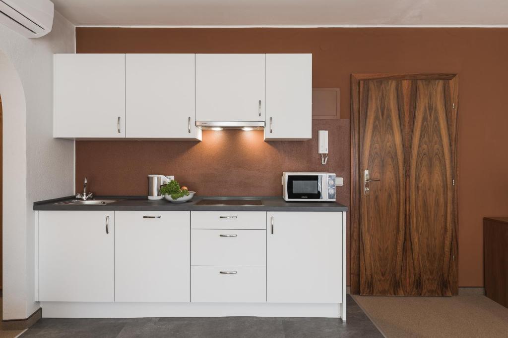 Kuchyňa alebo kuchynka v ubytovaní Residence Désirée Classic & Design