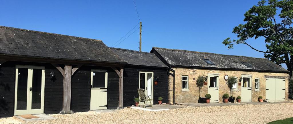 an old brick building with white doors and aphaltphaltphalt at Bridleway Bed & Breakfast in Lincoln