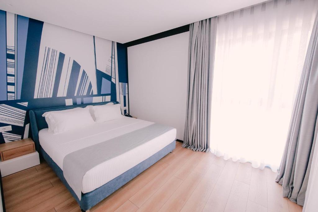 Postel nebo postele na pokoji v ubytování Amara Hotel & SPA
