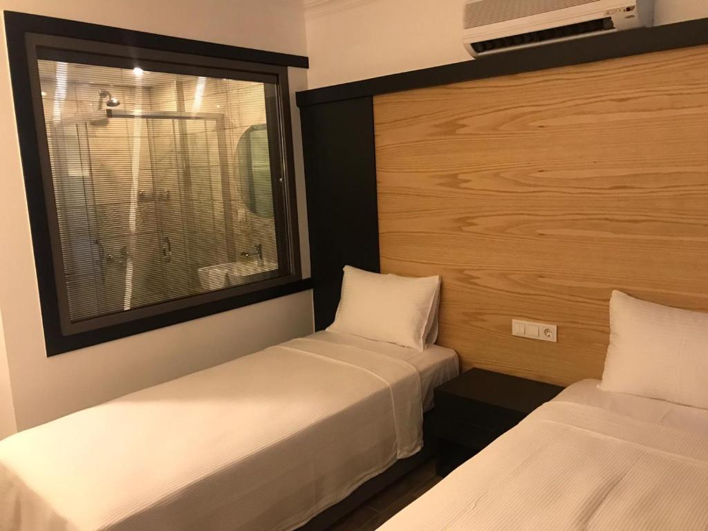Postel nebo postele na pokoji v ubytování On Oda Oludeniz