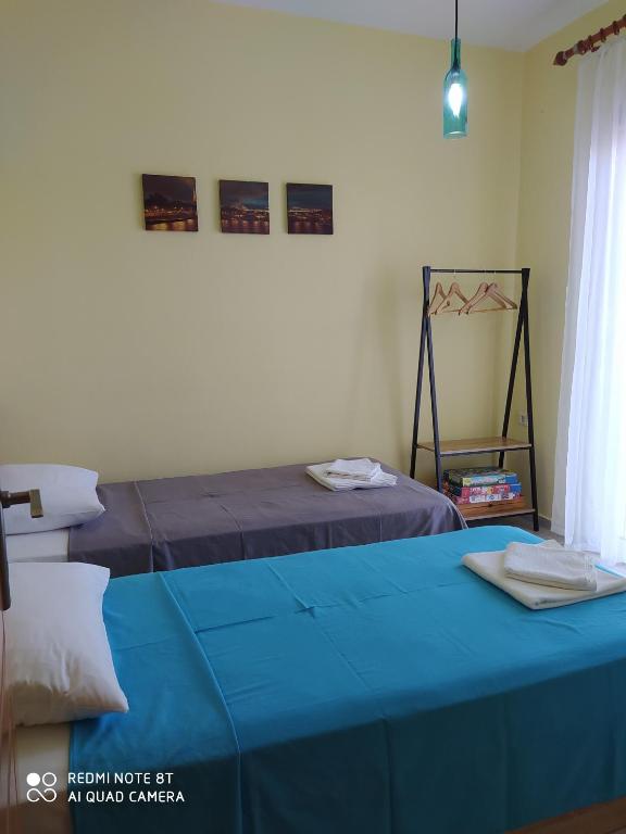A bed or beds in a room at SEA AND SKY APARTMENT