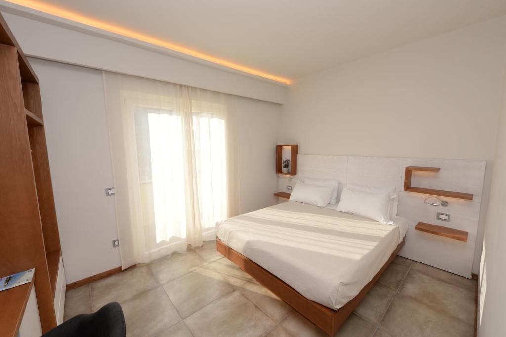 Postel nebo postele na pokoji v ubytování B&B Maestrale
