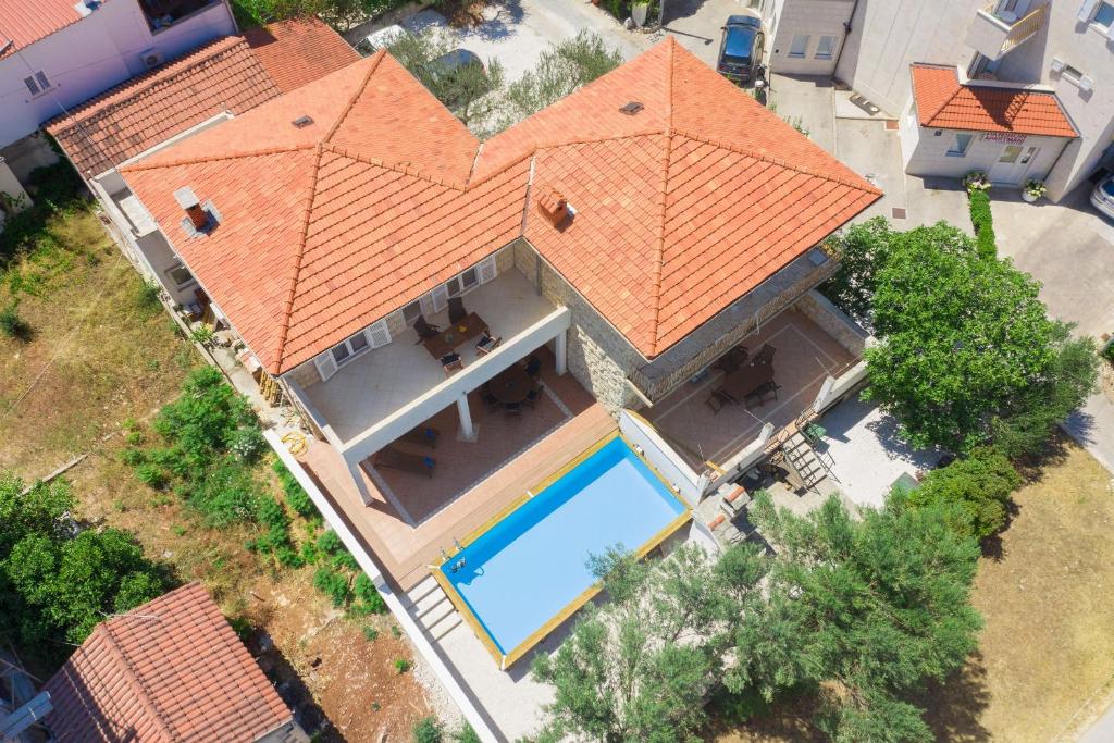 an overhead view of a house with an orange roof at Holiday home Kate Supetar in Supetar