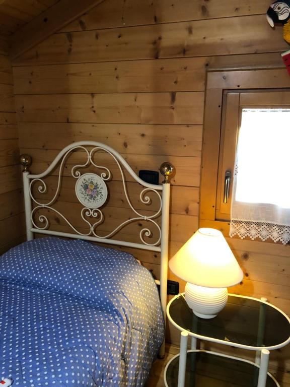 Postel nebo postele na pokoji v ubytování CHALET B&B LAGHETTI MARTINA