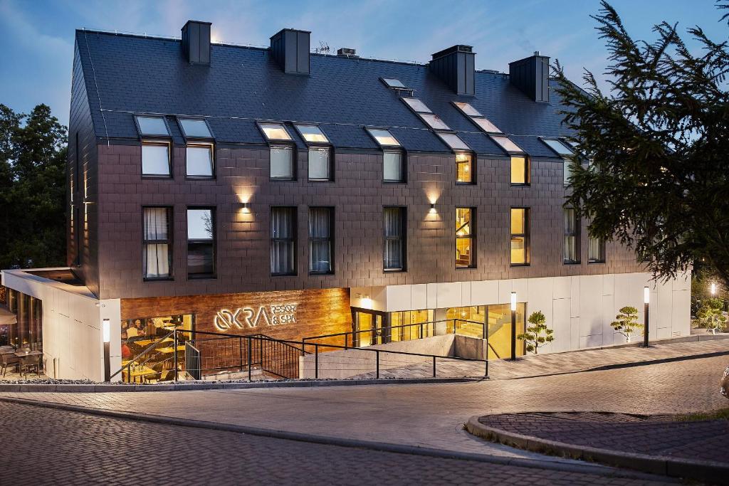 a building with a skate ramp in front of it at OKRA RESORT & SPA in Drawsko Pomorskie