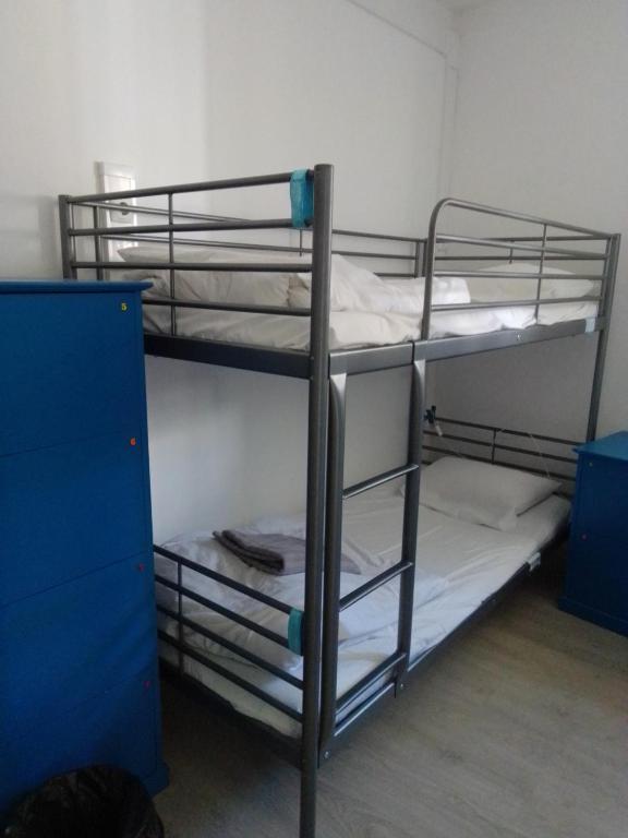 Cama ou camas em um quarto em Old Évora Hostel
