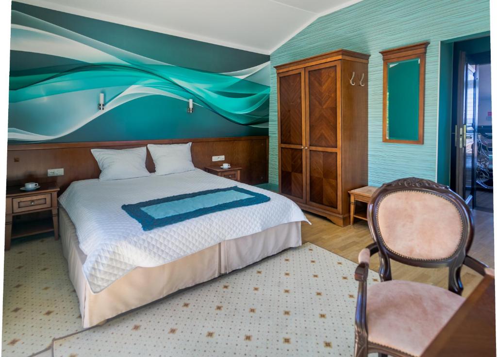 Postel nebo postele na pokoji v ubytování Hotel Apollo
