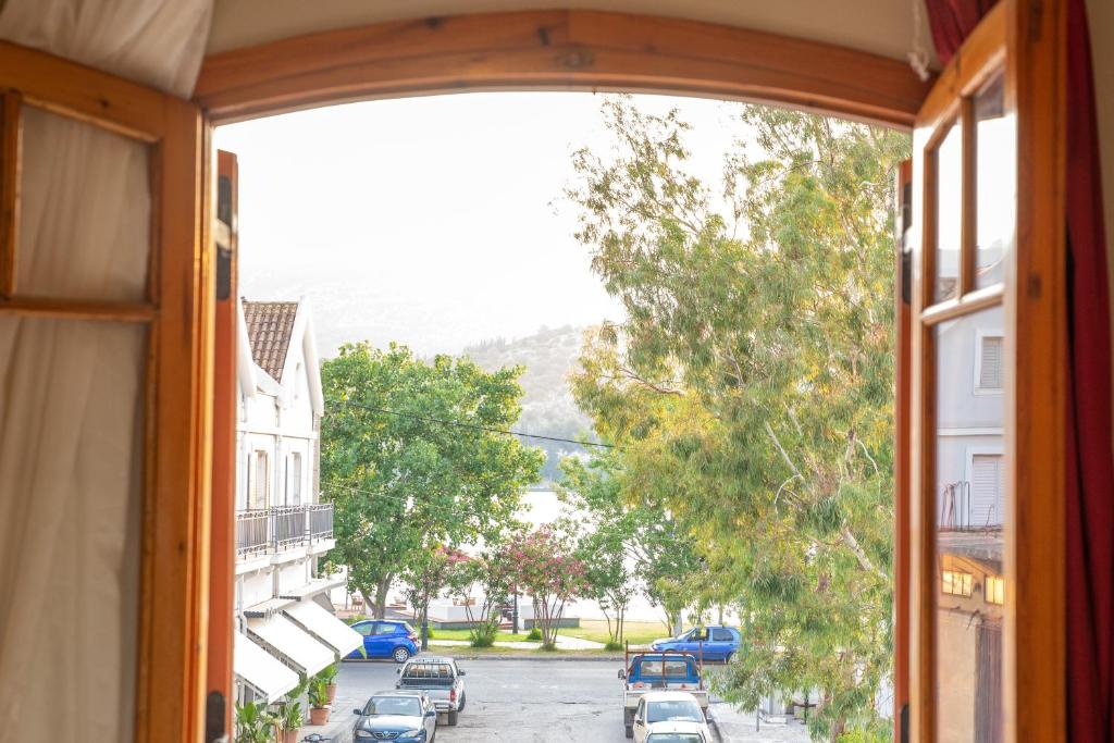 an open window with a view of a street at Sisiotisa in Argostoli