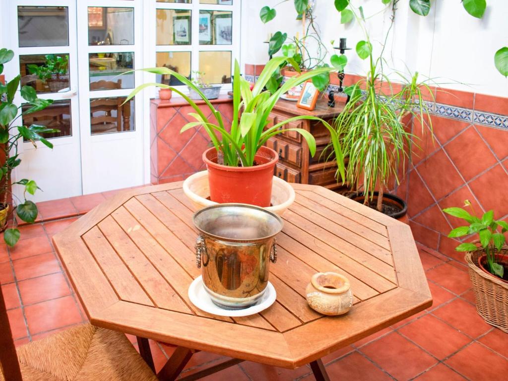 a wooden table with a tea pot on it at Belvilla by OYO Preciosa casa en Sevilla in Seville