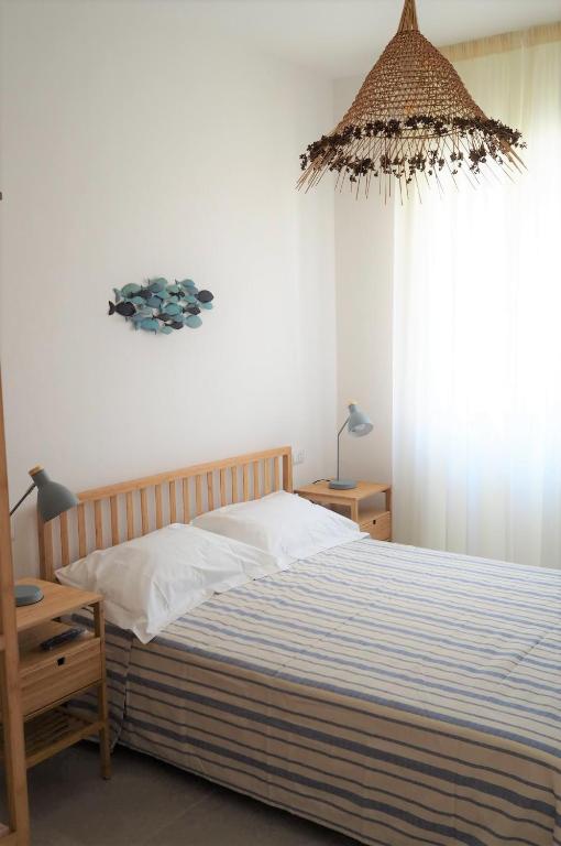 Postel nebo postele na pokoji v ubytování Il Rifugio del Navigante