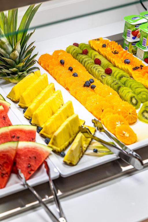 a tray of food with fruit on a table at Lagos Atlantic Hotel in Lagos