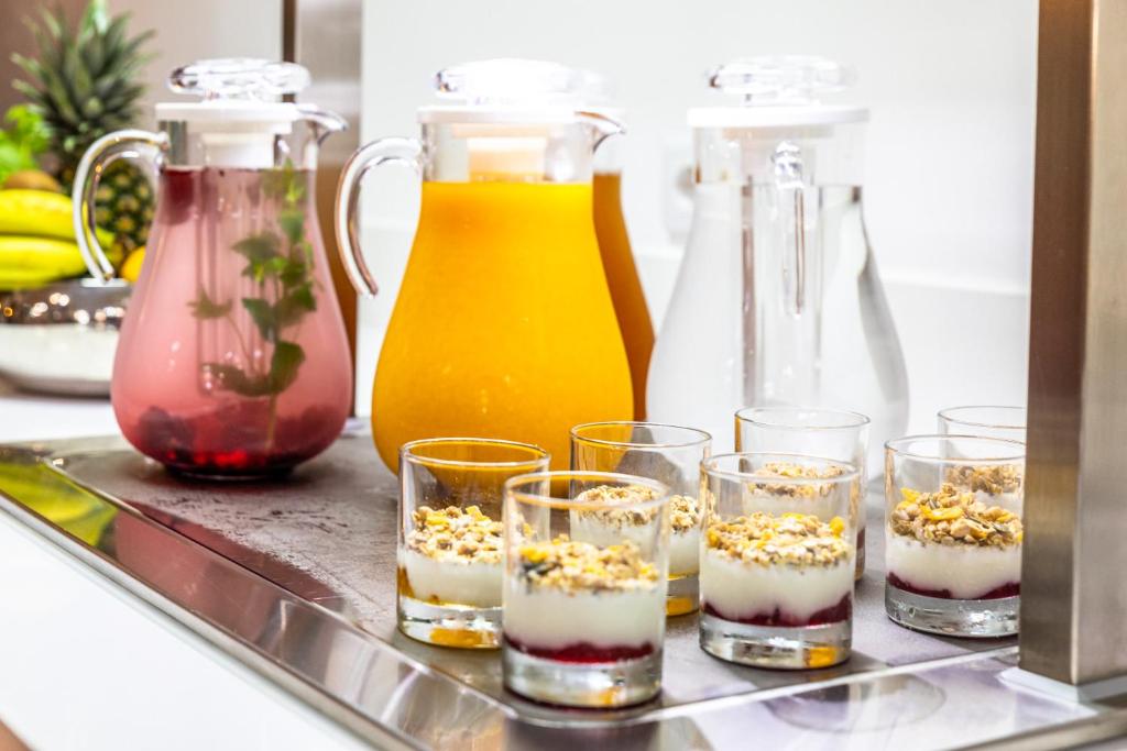 a tray with glasses of desserts on a counter at Lagos Atlantic Hotel in Lagos