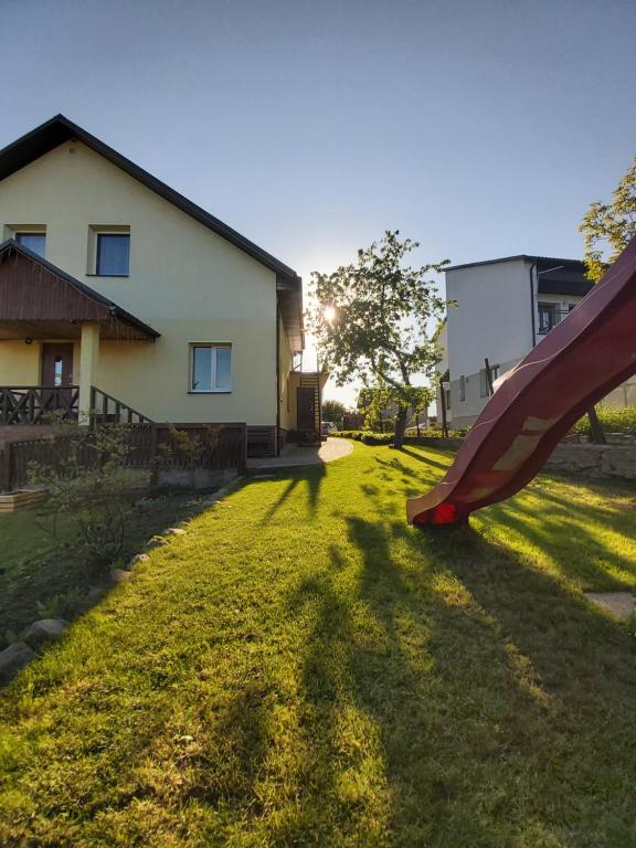 a slide in the yard of a house at Apartments by the lake with fireplace in Trakai