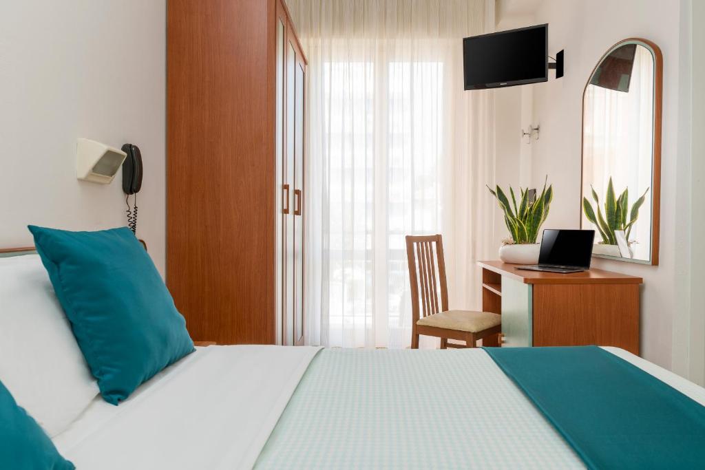 Postel nebo postele na pokoji v ubytování Hotel Très Jolie