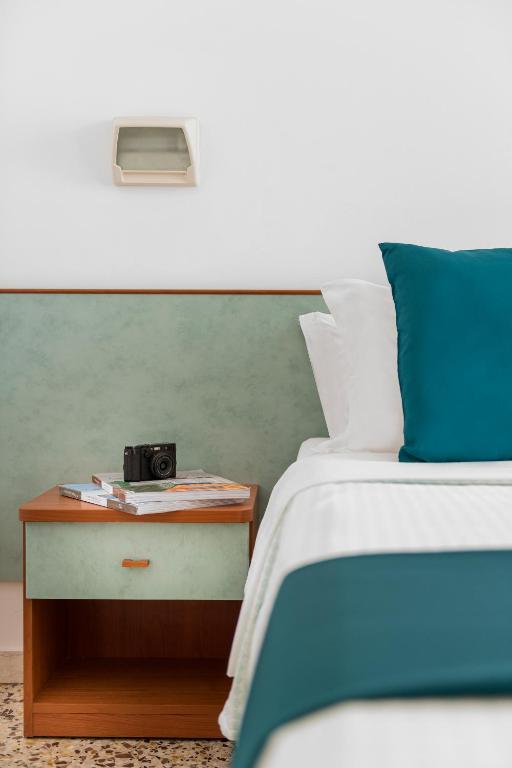 Postel nebo postele na pokoji v ubytování Hotel Très Jolie