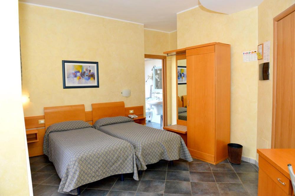 Postel nebo postele na pokoji v ubytování Hotel Blue Rose's