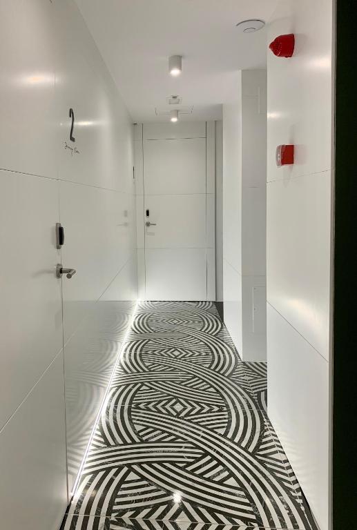 a hallway with a zebra pattern on the floor at Mamma Mia Hotel Boutique - Only Adults in Tossa de Mar