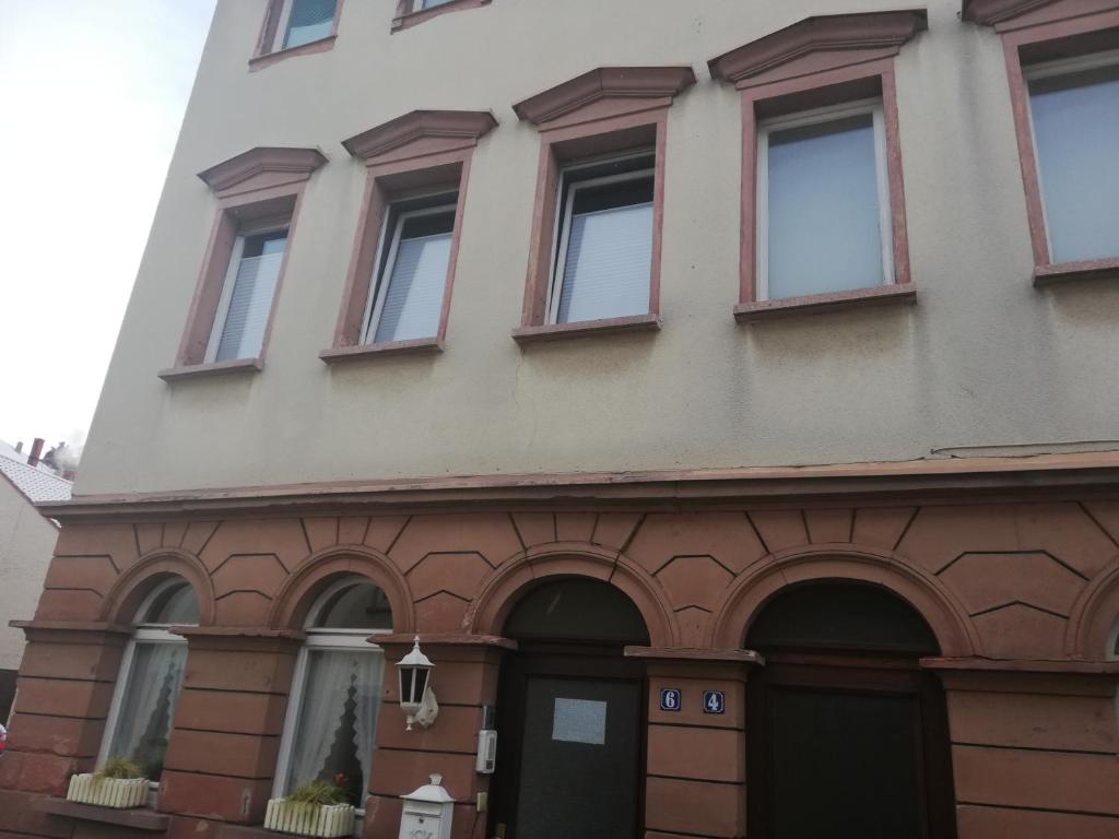 a building with a bunch of windows on it at Ferienzimmer Saatmann in Amorbach