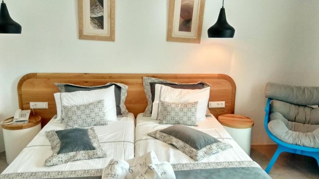 Postel nebo postele na pokoji v ubytování Harmony Boutique Hotel