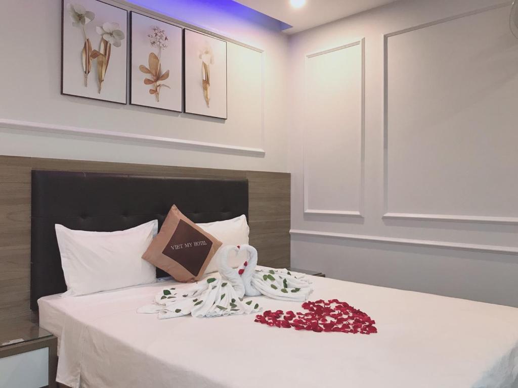 Postel nebo postele na pokoji v ubytování Hotel Việt Mỹ
