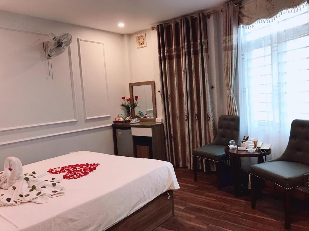 Postel nebo postele na pokoji v ubytování Hotel Việt Mỹ
