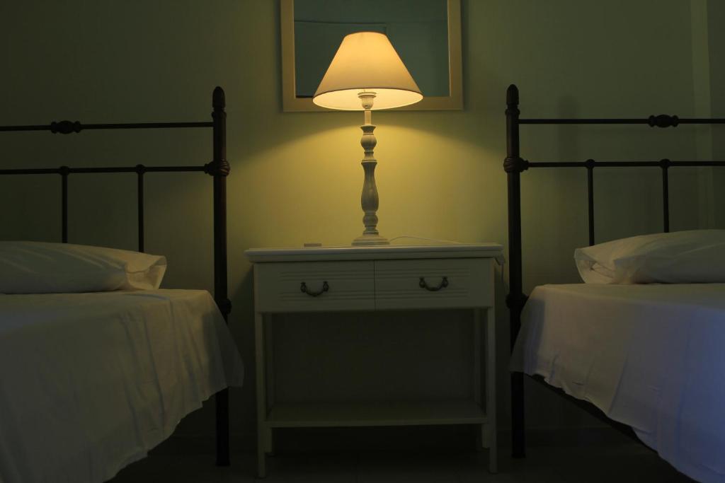 A bed or beds in a room at iliobasilema studios & apartments