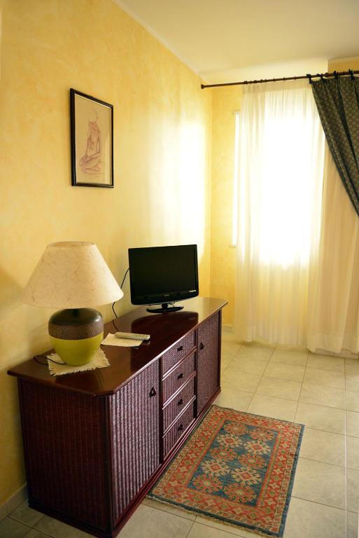 TV a/nebo společenská místnost v ubytování Hotel Blue Rose's