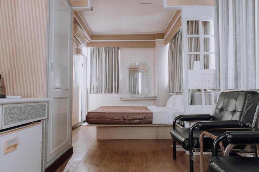 Postel nebo postele na pokoji v ubytování Tong Hsin Hotel