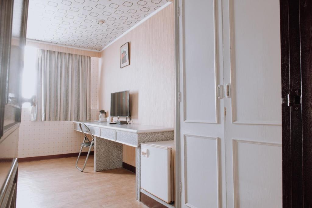 TV a/nebo společenská místnost v ubytování Tong Hsin Hotel