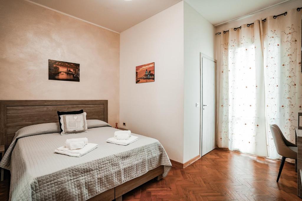 Łóżko lub łóżka w pokoju w obiekcie Angelica Home