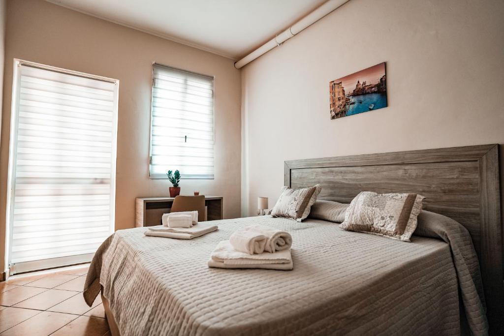 Łóżko lub łóżka w pokoju w obiekcie Angelica Home
