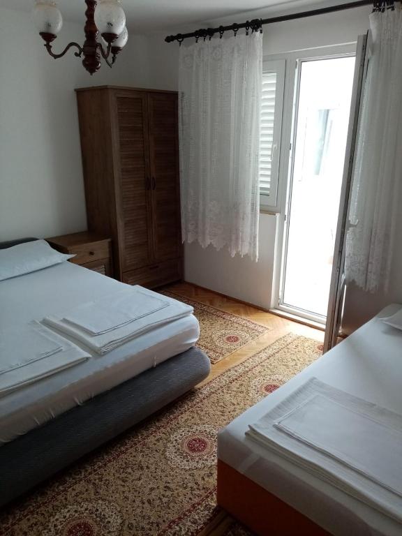 Postel nebo postele na pokoji v ubytování Apartment Dada 2